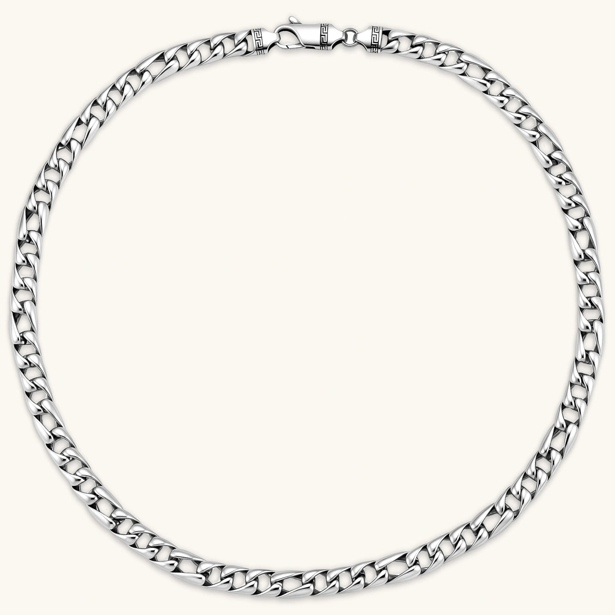 Chunky antique silver plated eco-brass curb chain necklace with a lobster clasp and Greek key detail on a cream background.