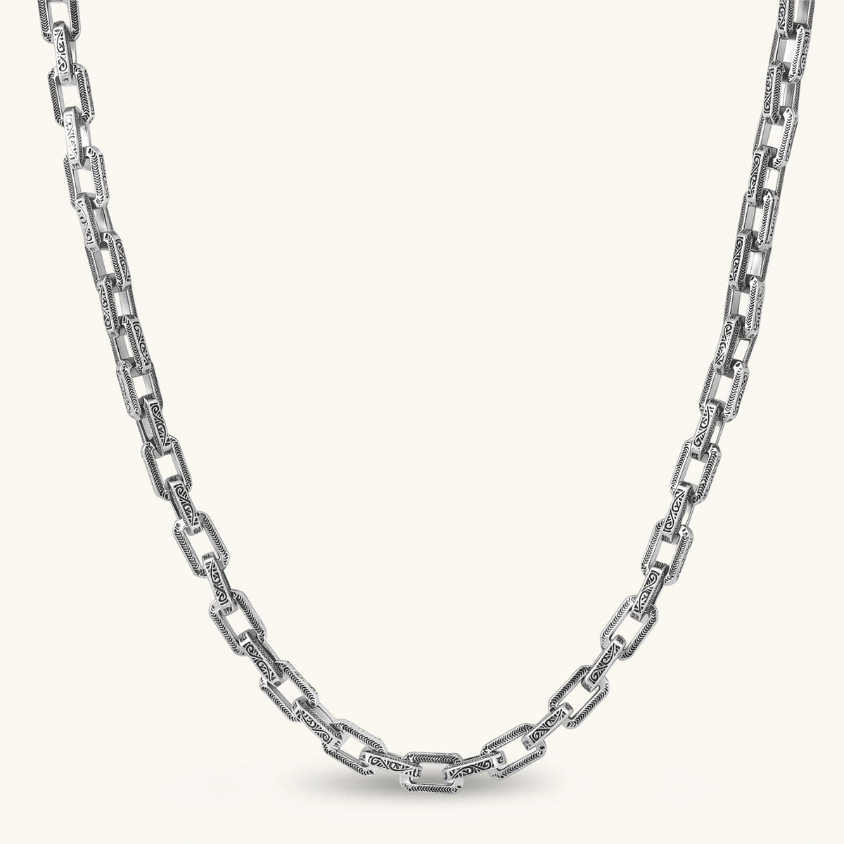 Antique silver plated eco-brass chain necklace with rectangular links etched in herringbone and scroll patterns, with a barrel clasp.