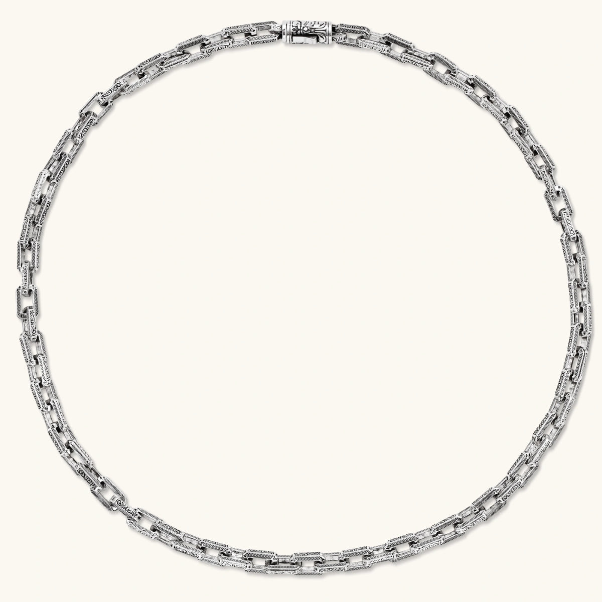 Antique silver plated eco-brass chain necklace with rectangular links etched in herringbone and scroll patterns, with a barrel clasp.