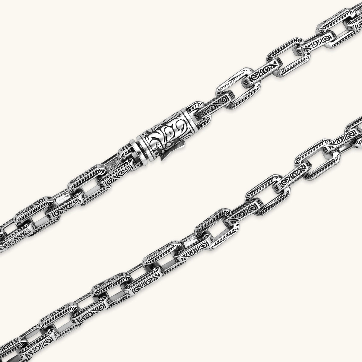 Antique silver plated eco-brass chain necklace with rectangular links etched in herringbone and scroll patterns, with a barrel clasp.